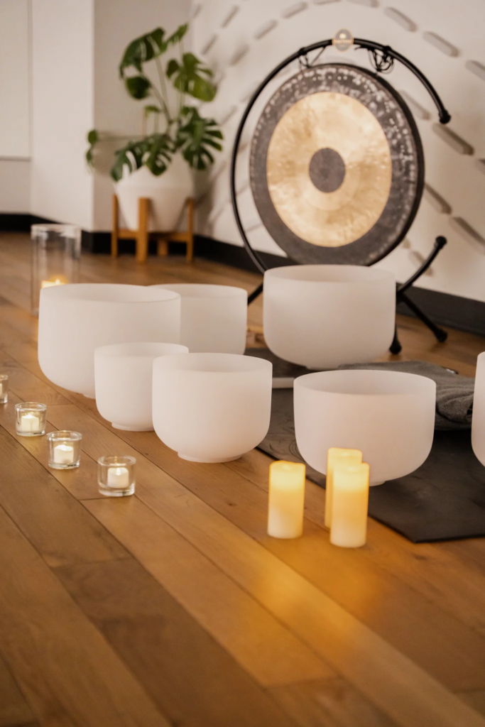 Collection of singing bowls and candles